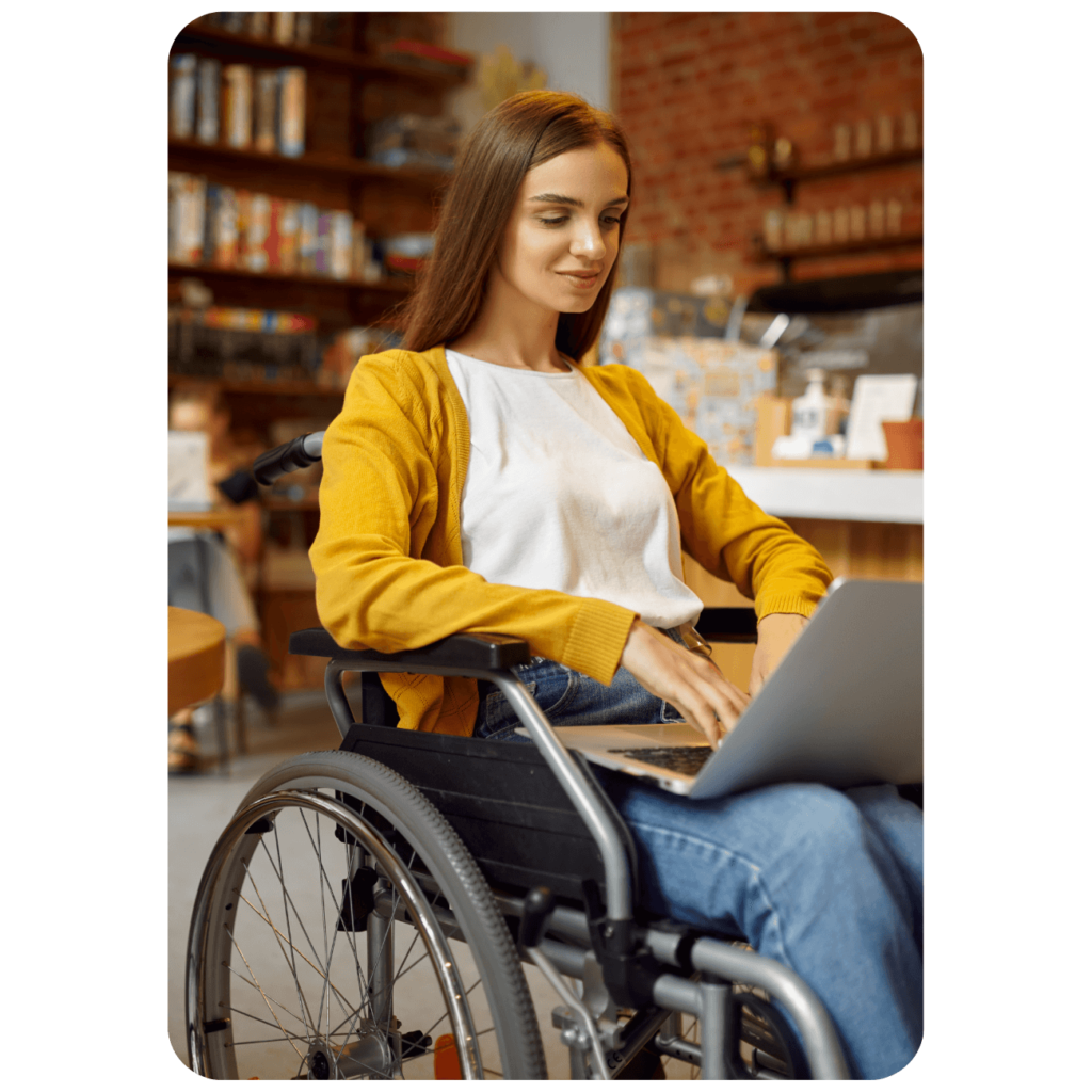 woman in wheelchair uses internet connection in library